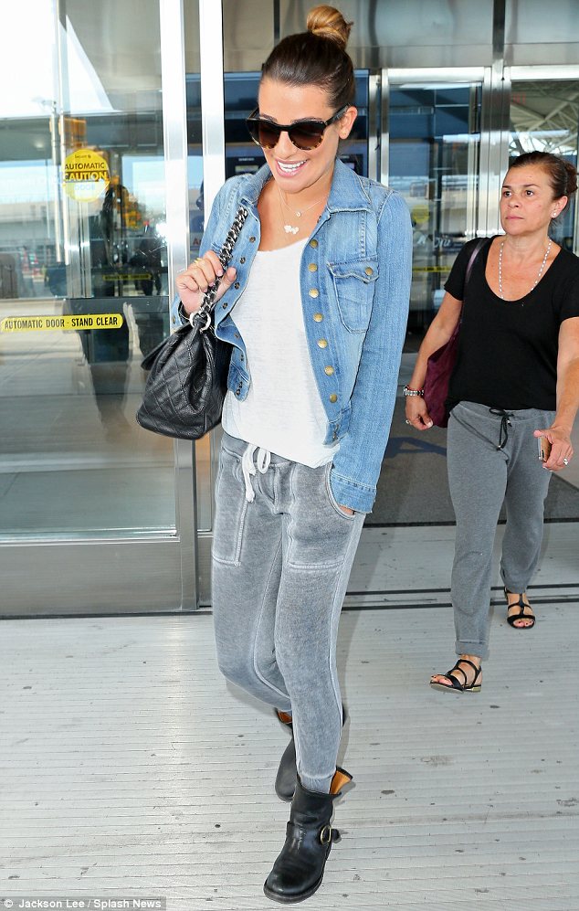 Lea Michele flashes a brave smile as she makes her first trip to New York since tragic death of Cory Monteith  